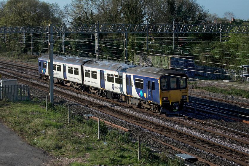 150134, 08.07 Wolverton Centre Sidings-Newton Heath TMD (5XXX, 36E), site of Roade station 
 This particular working had been highlighted on the forums and as it was a short distance from home and on the way to the garage to get some bread I thought it was worth a shot! Having received some attention at Wolverton works, 150134 is returning home to the north and its depot at Manchester's Newton Heath. It is seen having just started its journey passing the site of Roade station as the 08.07 Wolverton Centre Sidings to Newton Heath but I don't know what the reporting number was. If anybody can oblige it would be appreciated! 
 Keywords: 150134 08.07 Wolverton Centre Sidings-Newton Heath TMD site of Roade station Northern