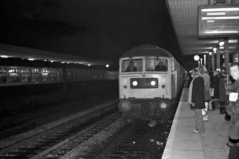 47108, unidentified London Paddington working, Oxford station 
 Breaking the rules at Oxford station by using a flash on the camera! 47108 arrives at the station with an unidentified working for London Paddington, as the display says, calling at Reading only. 47108 led a pretty uneventful life from being released to traffic as D1696 in December 1963 to withdrawal in March 1994. 
 Keywords: 47108 London Paddington working Oxford station