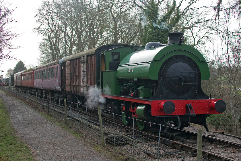 No. 4, 12.00 Pitsford return 'Mince Pie Special', Pitsford sidings 
 After a number of years with no serviceable steam traction the Northampton and Lamport Railway is finally able to offer the visitors to a heritage line what they really are coming for! Hawthorne Leslie 0-4-0ST No. 3718 now running simply as No. 4 passes Pitsford sidings with the 12.00 return service from Pitsford and Brampton. This locomotive dates from 1928 being originally built for the Associated Portland Cement Company (APC) of Swanscombe, Kent where, after retirement in the early 1970s, it was moved around various heritage lines ending up at Barrow Hill where it underwent restoration. It arrived on the NLR in 2020 having been in operation at the Buckinghamshire Railway Centre for a number of years. It is really good that steam is in operation on this line again and that it will hopefully bring the punters in with their money! 
 Keywords: No. 4 12.00 Pitsford return 'Mince Pie Special' Pitsford sidings NLR Northampton and Lamport Railway Hawthorne Leslie 0-4-0ST No. 3718 Swanscombe No.4