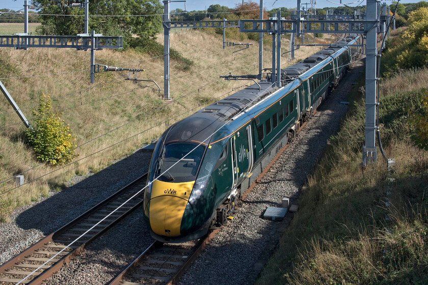 800019, GW 12.18 London Paddington-Cardiff Central (1B14, RT), Bourton SU232875 
 Prior to electrification, this spot down a lane and bridleway in the west Oxfordshire village of Bourton was a favourite of mine. With its wide-open views of the line and uncluttered embankments, it was a joy to sit and watch trains and take some photographs, see.... https://www.ontheupfast.com/p/21936chg/27762389604/x43158-13-30-london-paddington-bristol . However, since the arrival of the wires, it has changed dramatically and on my first visit back it has lost a little of its magic. 800019 'Johnny Johnson/Joy Lofthouse' heads west working the 1B14 12.18 Paddington to Cardiff GWR service. 
 Keywords: 800019 12.18 London Paddington-Cardiff Central 1B14 Bourton SU232875 GWR IET Johnny Johnson Joy Lofthouse