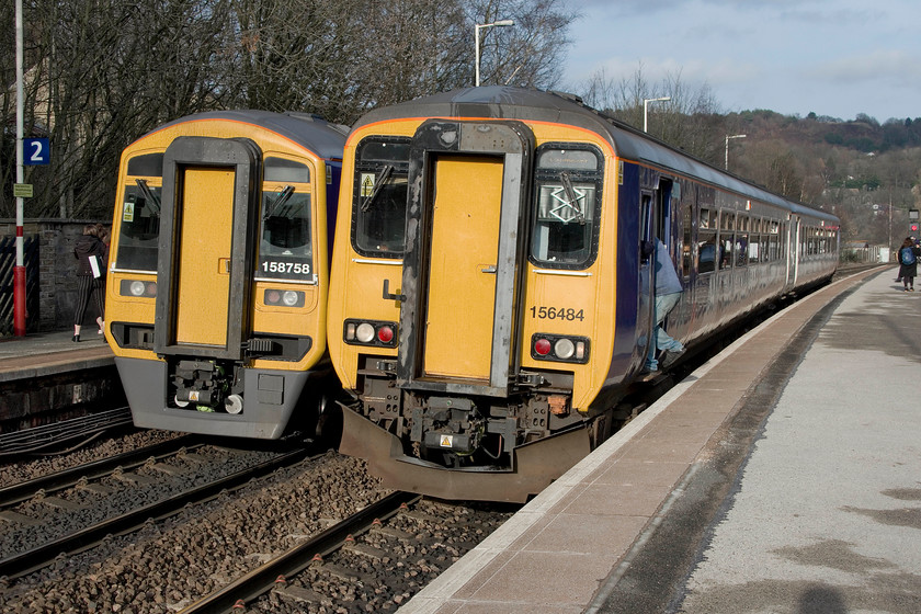 158758, NT 14.58 Manchester Victoria-Leeds (2E19, 2L) & 156484, NT 14.20 Leeds-Southport (1J19, 1E), Todmorden station 
 A crossing of Northern services at Todmorden station. To the left, 158758 waits with the 14.58 Manchester Victoria to Leeds whilst to the right, 156484 waits for the RA with the 14.20 Leeds to Southport. 
 Keywords: 158758 14.58 Manchester Victoria-Leeds 2E19 156484 14.20 Leeds-Southport 1J19 Todmorden station