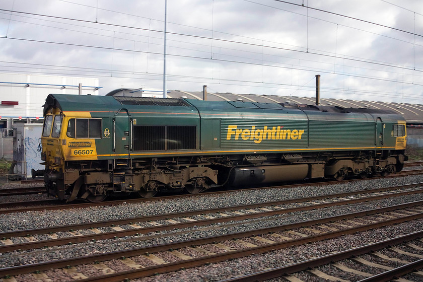 66507, stabled, Wembley Yard 
 Taken from our train as we passed Wembley Yard, 66507 is seen stabled awaiting its next duty. 
 Keywords: 66507, stabled, Wembley Yard