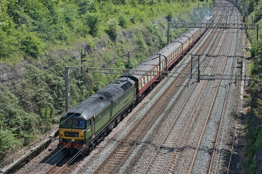 D1924 & D1935, 10.10 Liverpool Lime Street-Wembley Central (1Z86, 6L), Roade cutting 
 With D1924 'Peter Bath MBE 1927-2006' doing all of the work at the front of the train D1935 'Roger Hosking MA 1925-2013' goes along for a free ride at the rear. The train was running as 1Z86 taking Liverpool fans to Wembley for the 2022 FA Cup Final that was to be a scintillating match that saw Liverpool beat Chelsea 6-5 on penalties with Greek international Konstantinos Tsimikas scoring the decisive winner (much to the delight of my Greek friend and railway associate Andy!). In years past there would have been a procession of footex services on Cup Final day with scratch sets of stock cobbled together and some unusual visiting locomotives leading the trains causing a stir within the spotter fraternity of the day! 
 Keywords: D1935 D1924 10.10 Liverpool Lime Street-Wembley Central 1Z86 Roade cutting Roger Hosking MA 1925-2013 Peter Bath MBE 1927-2006