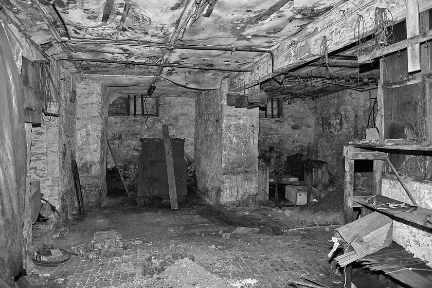 Undercroft, formally occupied by Bath Metal Plating Ltd, Bath Green Park station 
 A view through the broken window of the former Bath Metal Plating Ltd's premises located in the undercroft of Bath Green Park station. It appears that the company left in somewhat of a rush leaving behind all sorts of bits and pieces. Perhaps they simply shut down and left or maybe they were made an offer that they could not refuse following the derelict station above them being purchased by Sainsbury's for redevelopment? The undercroft is still in use today but looks a little more pleasant as is seen in this photograph, see.... https://www.somersetlive.co.uk/news/history/gallery/hidden-world-underneath-baths-green-2651470 
 Keywords: Undercroft formally occupied by Bath Metal Plating LTD Bath Green Park station