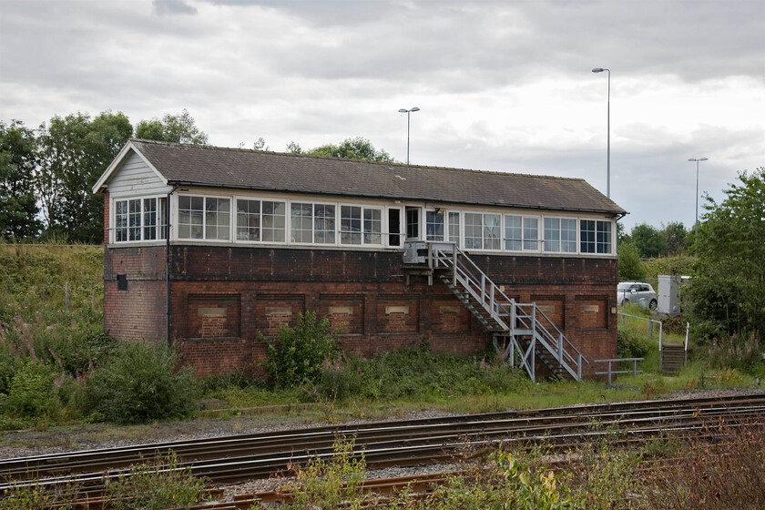 Bowesfield signal box (NE, 1905) 
 The impressively large Bowsfield signal box is seen taken standing looking over a wall of a recently completed housing estate. The box is a typical later design of North Eastern box dating from 1905 with its simpler lines. It contains a number of IFS panels no longer controlling semaphores at the busy triangular junction just to the right in this view. The last time that I took a photograph of this box was from a passing Class 101 DMU back in 1980, see https://www.ontheupfast.com/p/21936chg/29786104604/bowesfield-signal-box-north-eastern 
 Keywords: Bowesfield signal box North Eastern Railway