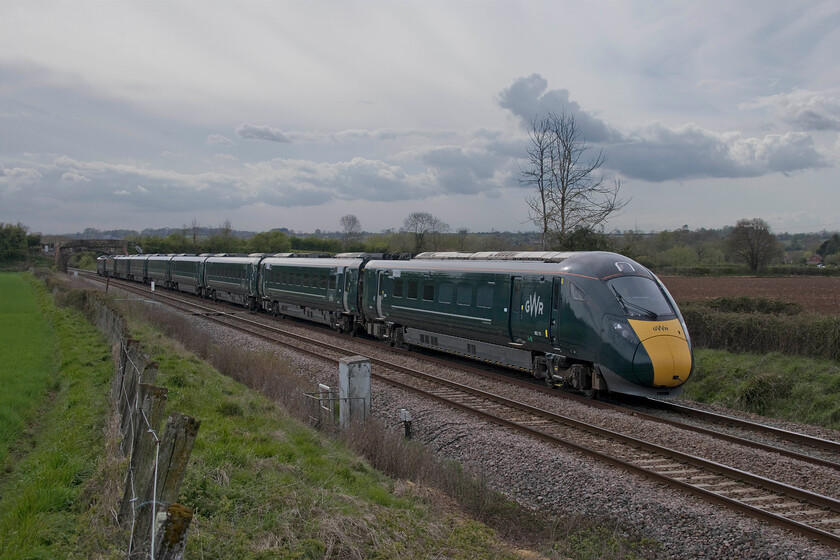 802111, GW 15.38 Exeter St. David's-London Paddington (1A81, 21L), Fairwood ST851513 
 Under a very stormy looking sky that was a precursor to some foul and wet weather later in the day, 802211 takes the Westbury route at Fairwood Junction just west of the Wiltshire town. The Great Western Railway IET was running at a reduced speed since Castle Cary, along with all other services, arriving twenty-one minutes adrift at Paddington working the 15.38 from Exter St. David's. I believe that this was a result of control informing drivers via GSMR of the identification of the cracking to the underframes that caused the temporary withdrawal of the entire fleet a few hours after this picture was taken. 
 Keywords: 802111 15.38 Exeter St. David's-London Paddington 1A81 Fairwood ST851513 GWR Great Western Railway IET