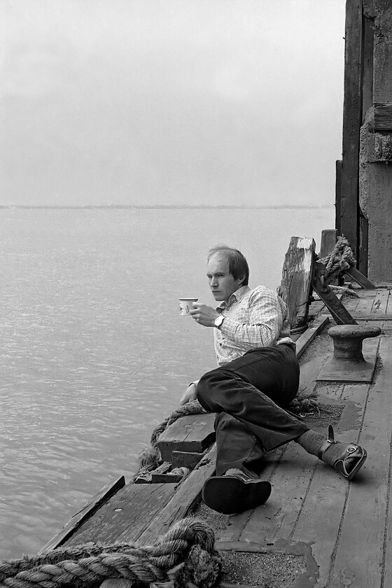 GGV enjoying a cup of tea, New Holland Pier 
 Graham enjoys a cuppa on New Holland pier staring wistfully out into the Humber estuary in the general direction of the new Humber Bridge that was to open the following week. I seem to remember that we spent a lot of time having a brew up at various locations when out on railway trips that involved firing up the pressure stove (paraffin powered) with a stop at a roadside caf a complete anathema! 
 Keywords: GGV enjoying a cup of tea New Holland Pier