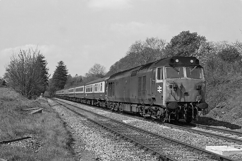 Class 50, unidentified up diverted working, Bradford-on-Avon no. 1 crossing, ST822605 
 An unidentified unrefurbished Class 50 approaches Bradford-on-Avon from the Bath direction with a diverted service heading for Paddington. It is about to cross what I colloquially called number 1 foot crossing with number 2 slightly further back level with the rear three quarters of the train. Amazingly, both foot crossings are still open but photographic opportunities are somewhat compromised by a giant telecommunications mast to the left here and rampant embankment growth. 
 Keywords: Class 50 up diverted working Bradford-on-Avon no. 1 crossing ST822605