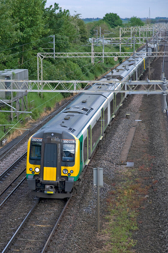 350238, 350242 & 350250, LM 17.46 London Euston-Birmingham New Street (1Y67), Victoria bridge 
 Another of London Midland's three-set evening commuter services that left half an hour after the previous one. The 17.46 Euston to Birmingham New Street 1Y67 is passing Victoria bridge between Northampton and Milton Keynes by 350238, 350242 and 350250. 
 Keywords: 350238 350242 350250 17.46 London Euston-Birmingham New Street 1Y67 Victoria bridge London Midland Desiro