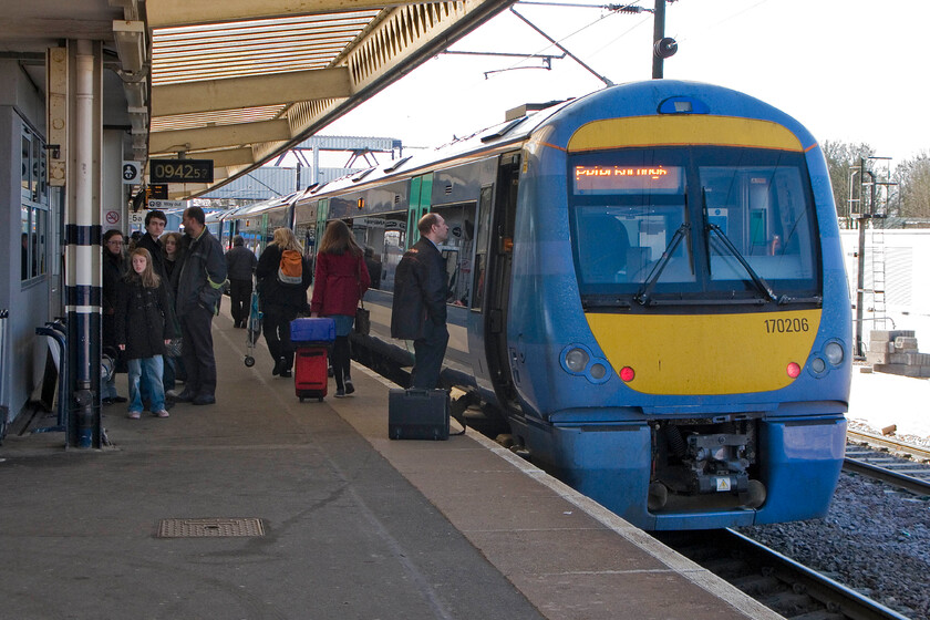 170206, GA 08.03 Ipswich-Peterborough, Peterborough station 
 This is about as far west as Greater Anglia gets! The 08.03 service from Ipswich, worked by 170206, has just terminated at Peterborough with the crew exchanging a few words prior to its departure back to Suffolk. Its dwell time is kept pretty short as platform five is a busy one that sees trains every few minutes; something that the extension of the station with the creation of two new platforms should take car of. 
 Keywords: 170206 08.03 Ipswich-Peterborough Peterborough station Greater Anglia