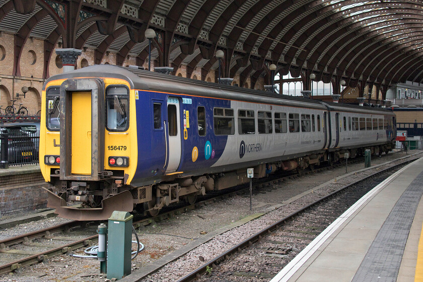 156479, stabled, York station 
 Dating from 1988 makes the Class 156 Super Sprinters relatively old now. Despite the introduction of new units by Northern these thirty plus years old units are still very much in front line service. 156479 stands stabled at York between duties. 
 Keywords: 156479 York station Northern Trains