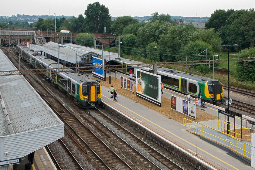 350118, LM 13.13 London Euston-Birmingham New Street & 350238, LM 12.54 London Euston-Northampton, Northampton station (from temporary footbridge) 
 The new temporary station footbridge installed at Northampton as part of its complete rebuild offers some interesting new views of the station. In this view, looking south, a pair of Class 350 London Midland Desiros stand at platforms two and three. 350118 is working the 13.13 Euston to Birmingham New Street whilst 350238 has just terminated with the 12.54 from Euston. 
 Keywords: 350118 13.13 London Euston-Birmingham New Street 350238 12.54 London Euston-Northampton, Northampton station from temporary footbridge London Midland Desiro