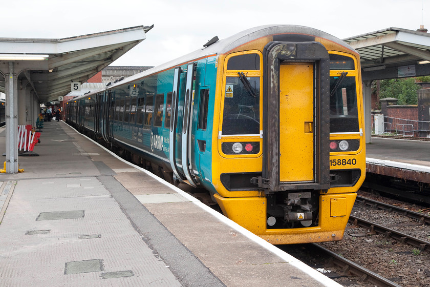 158840, AW 10.09 Birmingham International-Aberystwyth & Pwllheli (1J11 & 2J11), Shrewsbury station 
 Having travelled up from Birmingham International and stopped at Shrewsbury's platform six, 158840 and 158841 crew change ends ready for it to continue the journey as the 1J11 and 2J11 to Aberystwyth and Pwllheli, with the service splitting at Machynlleth. It was an enjoyable trip up from Birmingham on this ATW service, I like these units finding them roomy and comfortable. 
 Keywords: 158840 10.09 Birmingham International-Aberystwyth & Pwllheli 1J11 2J11 Shrewsbury station