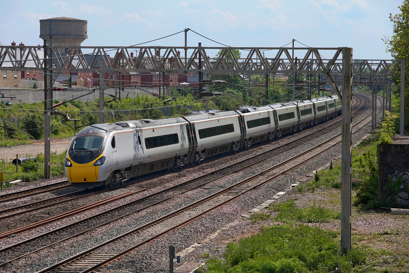 390005, VT 11.50 London Euston-Glasgow Central (1S63, 1E), site of Roade station 
 With the fast lines still closed for extended maintenance work and taking advantage of the emergency COVID timetable, 390005 'City of Wolverhampton' is on the down slow about to fork off towards Northampton as it passes Roade. It is working the 11.50 Euston to Glasgow Central 1S63 Avanti West Coast service. 
 Keywords: 390005 11.50 London Euston-Glasgow Central 1S63 site of Roade station Avanti West CoastPendolino City of Wolverhampton