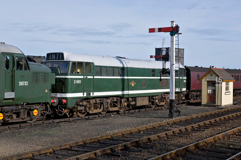 D6732 & D5631, stabled, Weybourne yard 
 A sea of British Railways green liveries at Weybourne Yard in the form of D6732 and D5631. Both these locomotives are quite at home in Norfolk always being associated with the railways in the county over the years. Whilst the North Norfolk Railway is best known and associated with steam hauled services they have a strong fleet of heritage diesel that is becoming an increasingly significant part of their heritage traction 'mix'. 
 Keywords: D6732 D5631 stabled, Weybourne yard Class 31 Class 37