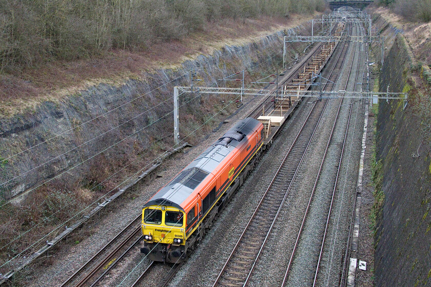 66509, 06.45 Queen's Park-Bescot Yard (6Y61, 56E), Roade cutting 
 Following overnight engineering works the 6Y61 06.45 Queen's Park to Bescot Yard train through Roade cutting. Looking smart in its orange livery Freightliner's 66509 'Joshia's Wish' leads the train with 66595 'NYK Spirit of Kyoto' switched off at the rear. 
 Keywords: 66509 06.45 Queen's Park-Bescot Yard 6Y61 Roade cutting'Joshia's Wish'