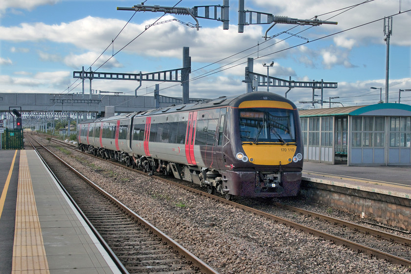 170110, XC 13.45 Cardiff Central-Nottingham (1M68, 1L), Severn Tunnel Junction station 
 170110, that is, in reality, a three-car DMU passes through Severn Tunnel Junction forming the 1M68 13.45 Cardiff to Nottingham service. I have said it before, but this is not a great way to travel, on certain sections of its journey, these services become extremely crowded with the Class 170s being totally unsuitable. If TransPennine Express can re-introduce 'proper' coaches with a locomotive hauling the train then services such as these and others, Norwich to Liverpool springs to mind, then CrossCountry (or their much-needed replacement) ought to be doing the same! 
 Keywords: 170110 13.45 Cardiff Central-Nottingham 1M68 Severn Tunnel Junction station