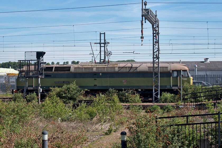 47830, 08.15 Crewe Basford Hall-Wembley Reception (0Z39, 8E), Rugby station 
 This is a Class 47 that has refused to die but looking at it very faded British Railway's green paintwork is it under threat again? Built as D1645 it became 47061 under TOPS to be renumbered 47649 early in 1986. Three years later it became 47830 being stopped at Garston in January 2008 for not being OTMR equipped. It was subsequently stored as 'okay' at Crewe where it languished for some seven years. It was named 'Beeching`s Legacy' in a ceremony at the NRM in November 2015. It is seen passing through Rugby southbound as the 0Z39 08.15 Crewe to Wembley light engine move. 
 Keywords: 47830 08.15 Crewe Basford Hall-Wembley Reception 0Z39 Rugby station Beeching`s Legacy