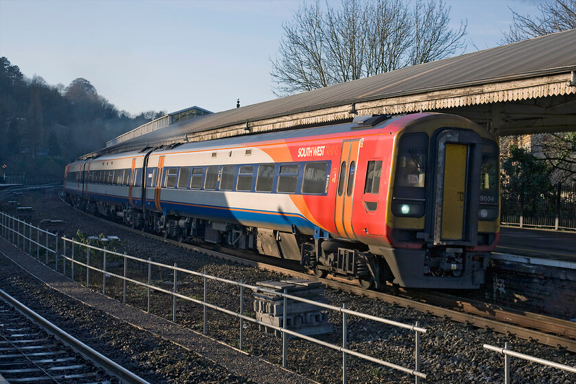 159004, SW 12.51 Bristol Temple Meads-Salisbury (1O48), Bath Spa station 
 With the afternoon sunshine now getting low in the sky, it is struggling to illuminate the whole length of a train at Bath Spa station as seen here. In order to get at least the front carriage in the sun, I have ventured to the eastern end of platform one as 159004 leaves working South West Trains' 12.52 Bristol to Salisbury service. On arrival at Salisbury, the unit should join with another Class 159 working from Exeter to continue its journey to Waterloo. 
 Keywords: 159004 12.51 Bristol Temple Meads-Salisbury 1O48 Bath Spa station South West Trains