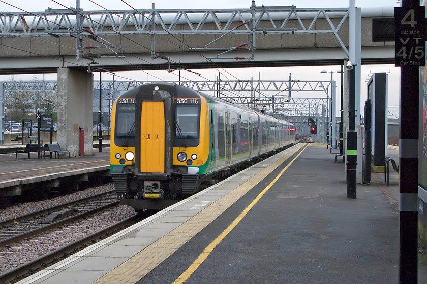 350115, LM 13.49 London Euston-Birmingham New Street (1W15), MiIlton Keynes station 
 350115 arrives at Milton Keynes station working the 13.49 Euston to Birmingham New Street 1W15 service. My wife and I took this train as the second and final part of of our journey home from London to Northampton. 
 Keywords: 350115 LM 13.49 London Euston-Birmingham New Street 1W15 Milton Keynes station London Midland Desiro