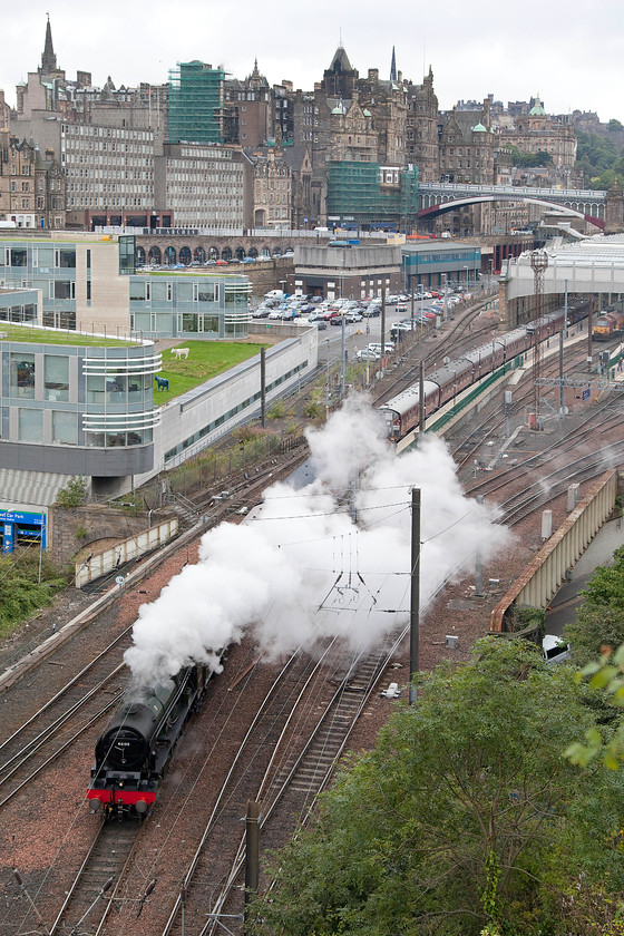 46100, outward leg of ScotRail Border`s Railway steam special, 09.46 Edinburgh Waverley-Tweedbank (1Z22), top of Jacob`s Ladder 
 With Edinburgh's Old Town in the background 46100 'Royal Scot' eases out of Waverley station with the 09.46 steam special to Tweedbank. The train is about to enter Calton North tunnel that is just below me as I stand on a wall adjacent to Regent Road atop Calton Hill. The type 7P 4-6-0 will lead the train all the way to Tweedbank from where a class 67, attached to the rear in this image, will haul the return journey. Later in the day the service is repeated with an afternoon run taking place. 
 Keywords: 46100 ScotRail Border's Railway steam special 09.46 Edinburgh Waverley-Tweedbank 1Z22 top of Jacob`s Ladder