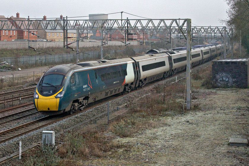 390130, VT 12.43 London Euston-Edinburgh Waverley (9S70, 10L) & 66302, 09.55 Tilbury-DIRFT (4M07, 29E), site of Roade station 
 Bowled! Sometimes it happens - the train that you have been waiting for and following on your 'phone gets blocked by another one. In this case, Avanti's Pendolino 390130 'City of Edinburgh' working to its namesake as the 9S70 12.43 from Euston has totally blocked the 4M07 09.55 Tilbury to Daventry Freightliner. If the latter had been hauled by a common or garden Class 66 that I have plenty of photographs of I would have shrugged my shoulders and not be too bothered. However, this freight was being hauled by 66302 'Endeavour' that I have precious few photographs of and none since it was named at the DRS Kingmoor Open Day in July 2019 an event that I actually attended. Despite my attendance, I failed to take a photograph of the locomotive for some unknown reason! 
 Keywords: 390130 12.43 London Euston-Edinburgh Waverley 9S70 66302 09.55 Tilbury-DIRFT 4M07 site of Roade station Avanti West Coast Pendolino Endeavour DRS Direct Rail Services City of Edinburgh