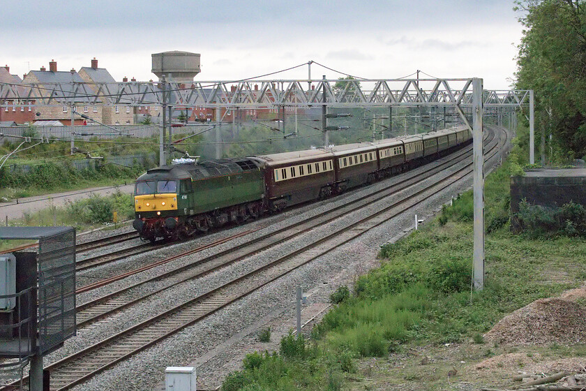 47815, return leg of The Northern Belle, 18.45 London Victoria-Manchester Victoria (1Z62, 5E), site of Roade station 
 Was it really worth it? I took a walk (admittedly a short one!) from home after dinner to capture the returning Northern Belle charter from London Victoria to Manchester Victoria but it was a very grey and dark spring evening with spots of rain in the air. Even worse, the dark green liveried 47815 'Lost Boys 68-88' doing its best to camouflage itself had been mustered from somewhere down south to haul the return train following the failure of 57314 during the outward journey. The train is seen passing Roade the final vestiges of brightness in the evening sky seen in the background. 
 Keywords: 47815 The Northern Belle 18.45 London Victoria-Manchester Victoria 1Z62 site of Roade station Lost Boys 68-88