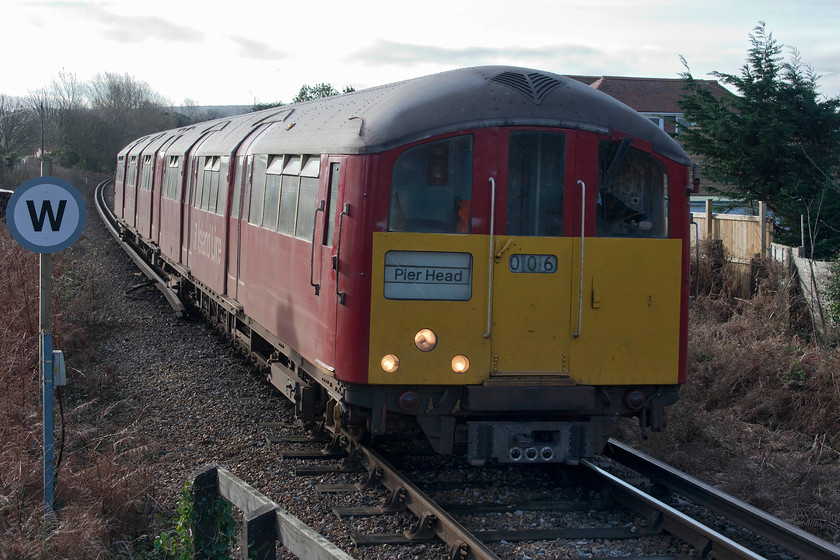 483006, SW 11.18 Shanklin-Ryde Pier Head (2U24), Lake station 
 483006 arrives at Lake station that is located between Shanklin and Sandown. Lake station was opened by BR in 1987 to serve the local community and visitors to Sandown Bay that is only five minutes' walk away. The station is built of timber in an elevated position with a basic shelter. Until the opening of Smallbrook Junction in 1991, Lake was the newest station on the island. 
 Keywords: 483006 11.18 Shanklin-Ryde Pier Head 2U24 Lake station Island Line SWT 1938 London Underground stock