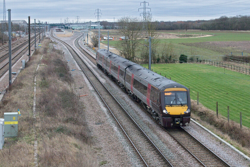 170102, XC 10.00 Cambridge-Birmingham New Street (1N49, RT), Marholm TF154036 
 The view looking south from Marholm's ever-popular (within the railway enthusiast fraternity at least!) footbridge reveals a very different view in terms of the track layout. With the Stamford lines now realigned and slewed away from each other the new dive-under that avoids conflicting moves crossing the ECML can be seen between them. This scheme, which is part of the 1.2bn East Coast upgrade, is approaching completion with the final stages of returning the wider site back to nature. CrossCountry's 170102 is seen leaving the Peterborough area working the 10.00 Cambridge to Birmingham New Street service. 
 Keywords: 170102 10.00 Cambridge-Birmingham New Street 1N49 Marholm TF154036 Cross Country