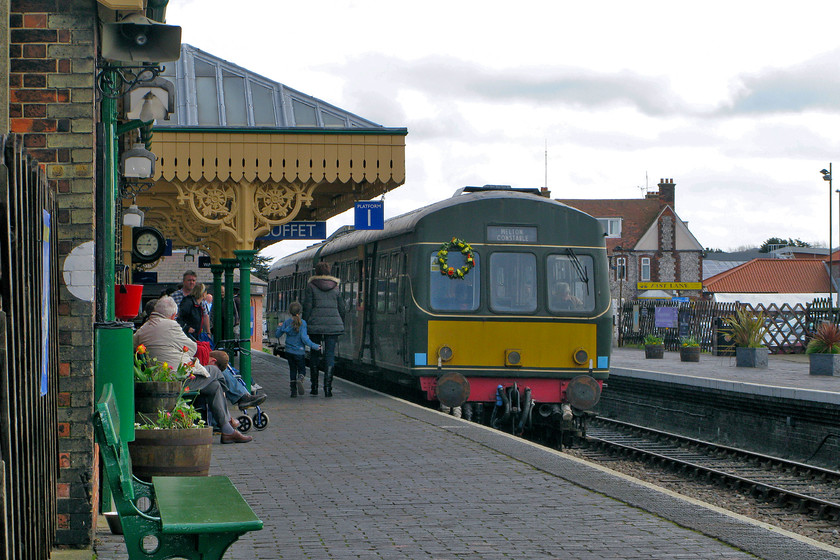 E51228 & E56062, 12.45 Sheringham-Holt, Sheringham station 
 A Class 101 DMU formed of cars E51228 and E56062 wait to leave Sheringham station with the 12.45 to Holt. Notice the wreath attached to the front of the leading car. This was to commemorate the closure of the last section of the M&GN (Midland & Great Northern Joint Railway) from Melton Constable to Sheringham (via Holt) exactly fifty years ago to the day on 06.04.64. 
 Keywords: E51228 E56062 12.45 Sheringham-Holt Sheringham station NNR North Norfolk Railway Poppy Line Class 101 DMU