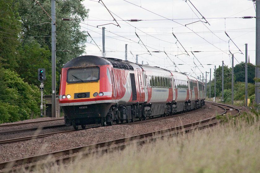 43320, GR 09.52 Aberdeen-London King`s Cross (1E15, 1E), Offord D`Arcy TL213652 
 43320 leads an HST set forming the 1E15 09.52 Aberdeen to London King's Cross past Offord D'Arcy some 469 miles from its start point. The train has the final 53 miles to go, a distance that it will complete in about 40 minutes. 43320 is an interesting power car. It was delivered to the Western Region in 1977 as 43120 but never assigned to a class 253 set. It was designated as a spare unit, along with 43121 before it moved to the Eastern Region to augment their services. 
 Keywords: 43320 1E15 Offord Darcy TL213652