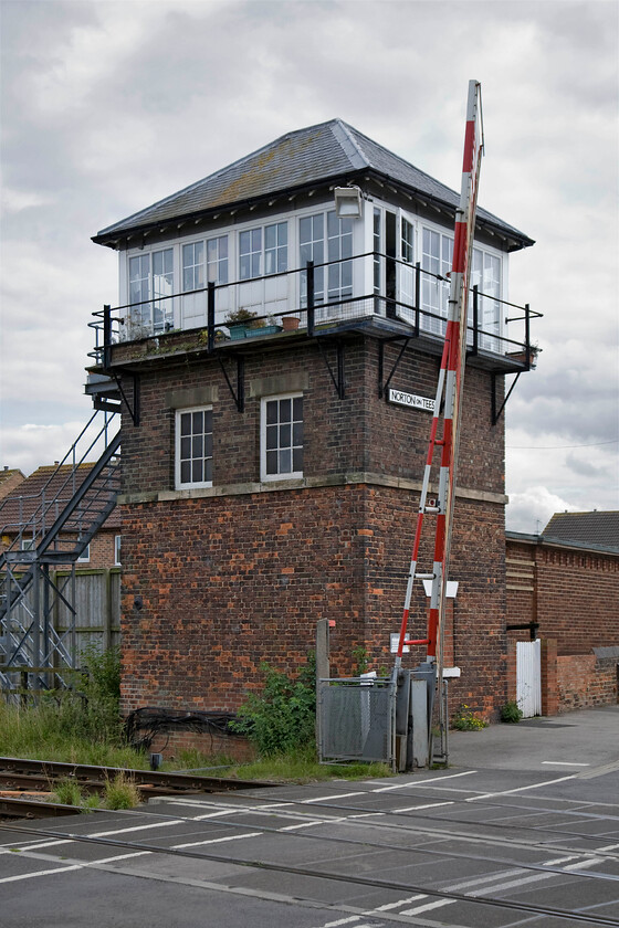 Norton-on-Tees signal box (NE, 1897) 
 The first of four signal boxes within a very short distance of each other in the northern part of the Teeside town of Stockton-on-Tees. Norton-on-Tees signal box is another of the North Eastern Railways taller boxes that, in this case, was constructed in 1897. It controls a level crossing on a quiet road leading to a new housing estate and some farms. The pub, directly across the road from the box is named The Norton and on its front wall hangs a pub sign showing the signal box in all its full glory! 
 Keywords: Norton-on-Tees signal box North Eastern Railway