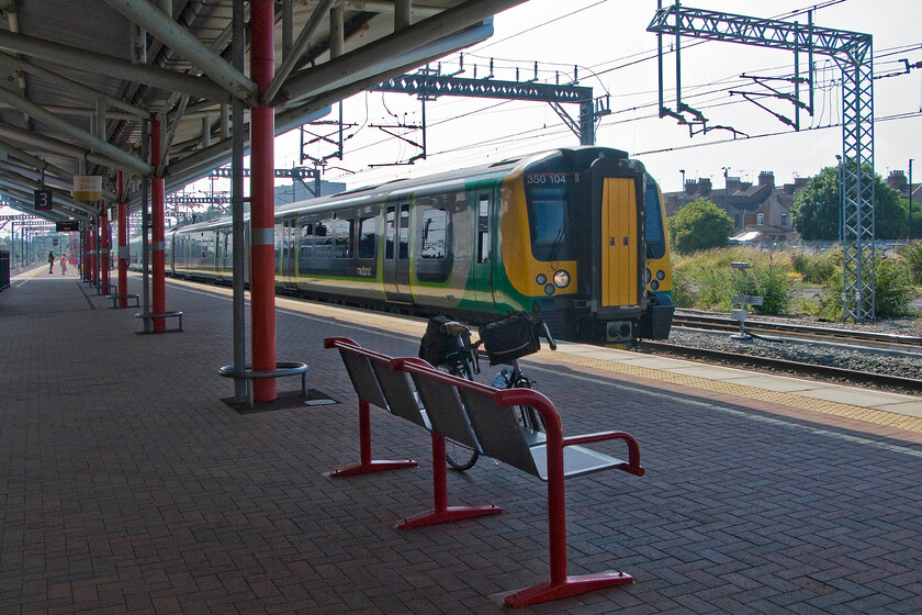 350104, LM 09.46 London Euston-Crewe (1U29), Rugby station 
 With my bike leaning against the bench in the foreground the second train of my journey to Lichfield arrives at Rugby station. We (my bike and I!) travelled aboard 350104 working the 09.46 Euston to Crewe service. 
 Keywords: 350104 09.46 London Euston-Crewe 1U29 Rugby station London Midland Desiro