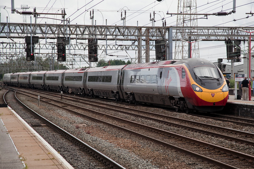 390011, VT 13.07 London Euston-Liverpool Lime Street (1F17), Crewe station 
 390011 'City of Lichfield' arrives at the southern end of Crewe station working the 1F17 13.07 London Euston to Liverpool Lime Street. Whilst Crewe remains somewhat of a magnet for enthusiasts, today it was particularly busy due to the Gresty Bridge open day that I had attended earlier. 
 Keywords: 390011 13.07 London Euston-Liverpool Lime Street 1F17 Crewe station