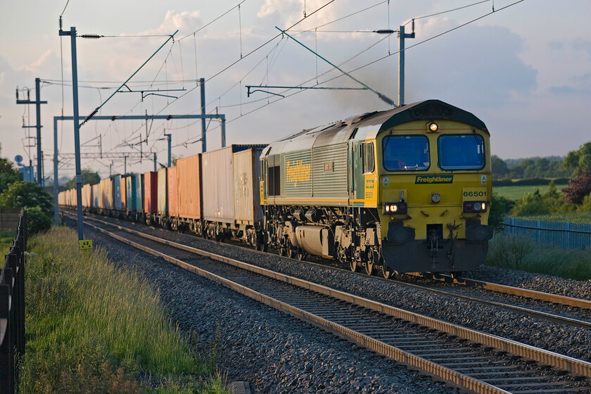 66501, 18.30 Lawley Street-Felixstowe North (4L73), Milton Malsor SP740553 
 With the evening light on the longest day beginning to fade (by now it was 20.26) 66501 'Japan 2001' leads the well-loaded 4L73 18.30 Lawley Street to Felixstowe North Freightliner past Milton Malsor near Northampton. As can be seen, the thundery-looking clouds are massing in the background heralding some overnight rain. 
 Keywords: 66501 18.30 Lawley Street-Felixstowe North 4L73 Milton Malsor SP740553 Japan 2001