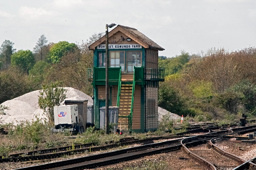 Bury St. Edmunds Yard signal box (GE, 1888) 
 It is difficult to get a decent picture of Bury St. Edmunds Yard signal box as it is somewhat remotely located in, a yard! The best I could manage is using my 80-200 zoom lens as shown here. The box is a typical timber constructed Great eastern box dating from 1888. It is grade II listed and rare as it has its original windows and that they extend all the way around the box affording views into the yard behind. When Kennett box closed in 2011, it took over the control of the long section to Chippenham Junction some thirteen miles to the west. 
 Keywords: Bury St. Edmunds Yard signal box