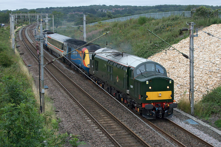 37521, 43046 & 43055, 07.14 Crewe HS-Eastleigh Arlington (5Z36, 2L), Milton Malsor SP738560 
 D6817 (37521) makes a fine racket as it gets away from Northampton approaching Milton Malsor towing former East Midlands Railway's HST power cars 43046 and 43055 with Mk.III 10416 sandwiched in the middle. Whilst the Mk.III was simply acting as a barrier the power cars were being taken to Eastleigh's Arlington Fleet Services' facility for attention. The train, running as 5Z36, left Crewe at 07.14 receiving a lot of attention by enthusiasts en route with plenty of updates. One observer was one of my railway chums, Mike, who had gone to see the train pass through Northampton station.

An audio recording of this event can be enjoyed at..... https://youtu.be/RbsW0zpMzGU . 
 Keywords: 37521 43046 43055 07.14 Crewe HS-Eastleigh Arlington 5Z36 Milton Malsor SP738560 EMR East Midlands Railway D6817