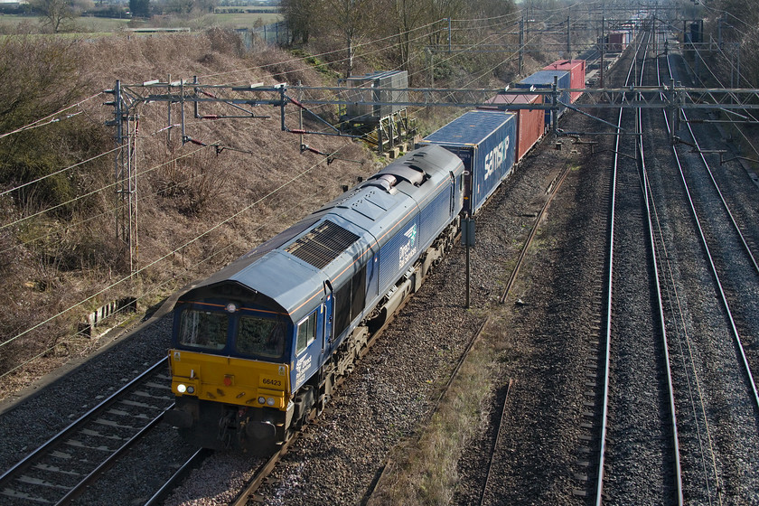 66423, 09.48 Tilbury-DIRFT (4M07), Victoria bridge 
 On my journey home from Weedon, I took the back route that found me passing my 'home spot' of Victoria bridge. I pulled in for five minutes but was too late for the 4L75 Basford Hall Freightliner, however, I did capture 66423 leading the 09.48 Tilbury to Daventry Railfreight Terminal. 
 Keywords: 66423 09.48 Tilbury-DIRFT 4M07 Victoria bridge