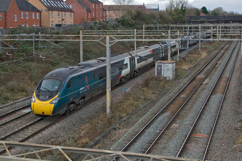 390127, VT 12.43 Liverpool Lime Street-London Euston (1A30, 4E), site of Roade station 
 My final photograph of my Christmas Eve walk along the length of Roade cutting sees 390127 emerge from it past the site of Roade station. It is working the 1A30 12.43 Liverpool Lime Street to Euston service. Time to go home for a mince pie and a cup of tea! 
 Keywords: 390127 12.43 Liverpool Lime Street-London Euston 1A30 site of Roade station