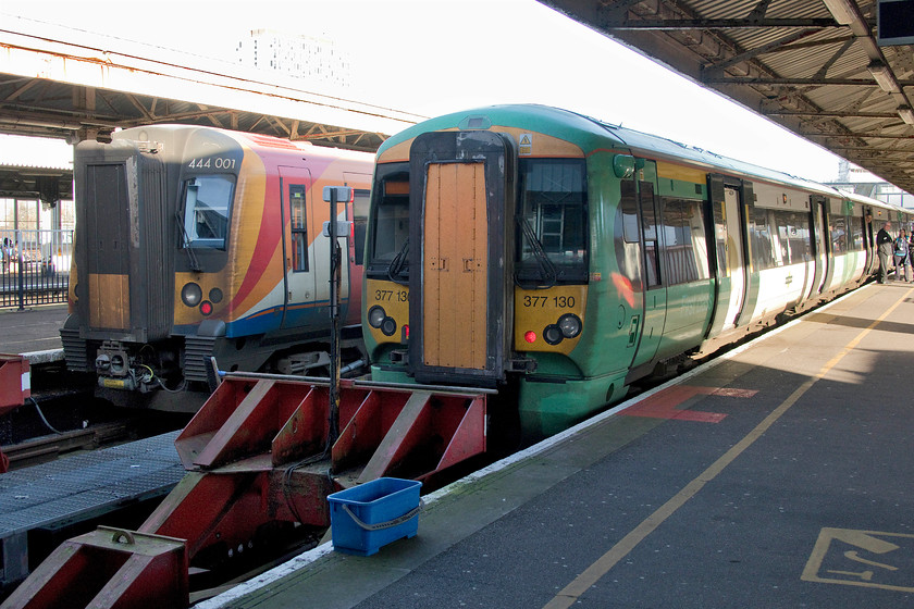 444001, SW 14.15 Portsmouth Harbour-London Waterloo (1P48, 4L) & 377130, SN 14.11 Portsmouth Harbour-London Victoria (1J41, RT), Portsmouth Harbour station 
 Back on the mainland at Portsmouth Harbour station, two operators' services stand side-by-side ready to leave for London. To the left South Western Railway's 444001 will leave working the 1P48 14.15 to Waterloo whilst Southern's 377130 will depart first with the 1J41 14.11 to Victoria. The former SWR service takes just over an hour and a half to make the seventy-five mile journey whilst the latter travels eighty-five miles taking exactly two hours. It's also interesting to remember that both these companies have recently been blighted by appalling industrial relations that have greatly impacted the travelling public. 
 Keywords: 444001 14.15 Portsmouth Harbour-London Waterloo 1P48 377130 14.11 Portsmouth Harbour-London Victoria 1J41 Portsmouth Harbour station South WEstern Railway SWR