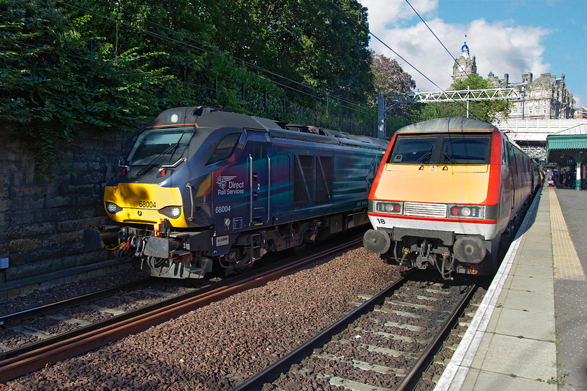 68004, SR 17.08 Edinburgh Waverley-Glenrothes-with-Thornton (2G13) & 91118, GR 17.00 Edinburgh-London King`s Cross (1E24), Edinburgh Waverley station 
 The evening 17.08 Edinburgh to Glenrothes-with-Thornton commuter service hauled by 68004 'Rapid' gets away from Waverley station. Next to it, 91118 is getting ready to propel the 17.00 to King's Cross away on its journey south. In theory, the 91 should have left ten minutes ago but obviously something has gone awry with a late departure not boding well for the journey to London. 
 Keywords: 68004 17.08 Edinburgh Waverley-Glenrothes-with-Thornton 2G13 91118 17.00 Edinburgh-London King`s Cross 1E24 Edinburgh Waverley station