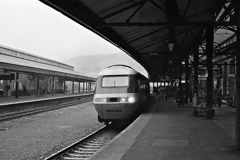 253004, unidentified down working, Bath Spa station 
 With its wiper caught in mid-sweep, HST set 253004 arrives at a very wet Bath Spa station working a Paddington to Bristol Temple Meads (or possibly to Weston-super-Mare) service. The HSTs had been in squadron service on trains to and from Bristol and South Wales for some four years when this photograph was taken with most spotters hardly giving them a second glance but I did actually take photographs of them. This power car would have been one of either 43062 or 43063. If was the former of the two it is now in use as part of Network Rail's fleet of yellow test trains. 
 Keywords: 253004 unidentified down working Bath Spa station HST