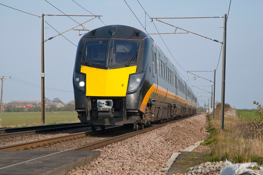 180108, GC 06.42 Sunderland-London King`s Cross (1A60, 28L), Frinkley Lane crossing SK906436 
 Evoking the style of many of my early photographs sees 180108 from a very low angle passing Frinkley Lane crossing just north of Grantham. The Grand Central class 180 is working the 1A60 06.42 Sunderland to King's Cross that was running rather late, eventually arriving at its destination twenty eight minutes down. 
 Keywords: 180108 06.42 Sunderland-London King`s Cross 1A60 Frinkley Lane crossing SK906436