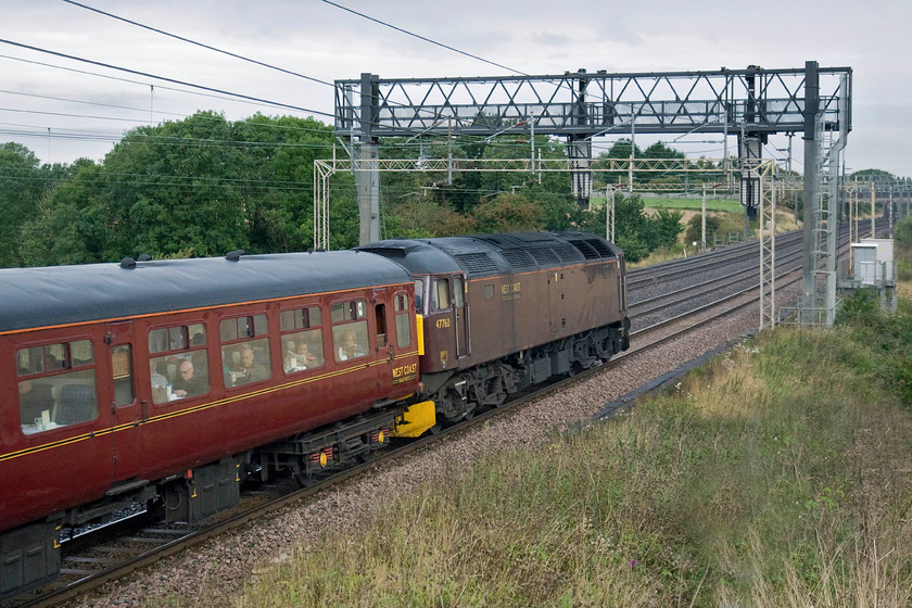 47760, outward leg of The Cathedrals Expresss, 07.16 Rugby-Bristol Temple Meads (1Z62, 34L), Roade hill 
 West Coast Railway's 47760 is seen being dragged along at the rear of The Cathedrals Express as it makes its way south on the up slow line between Roade and Ashton. At the front Coronation Class 46233 'Duchess of Sutherland' is hauling the train that left Rugby heading for Bristol. Unfortunately, the Coronation was only able to haul the charter as far as Southall with 47760 taking over due to gauging issues. I find it staggering that when the charter was being planned, a major undertaking in itself, that a relatively simple issue such as a locomotive being out of gauge had not been spotted. I suspect that it was due to electrification works being undertaken on the GWML. 
 Keywords: 47760 The Cathedrals Express, 07.16 Rugby-Bristol Temple Meads 1Z62 Roade hill