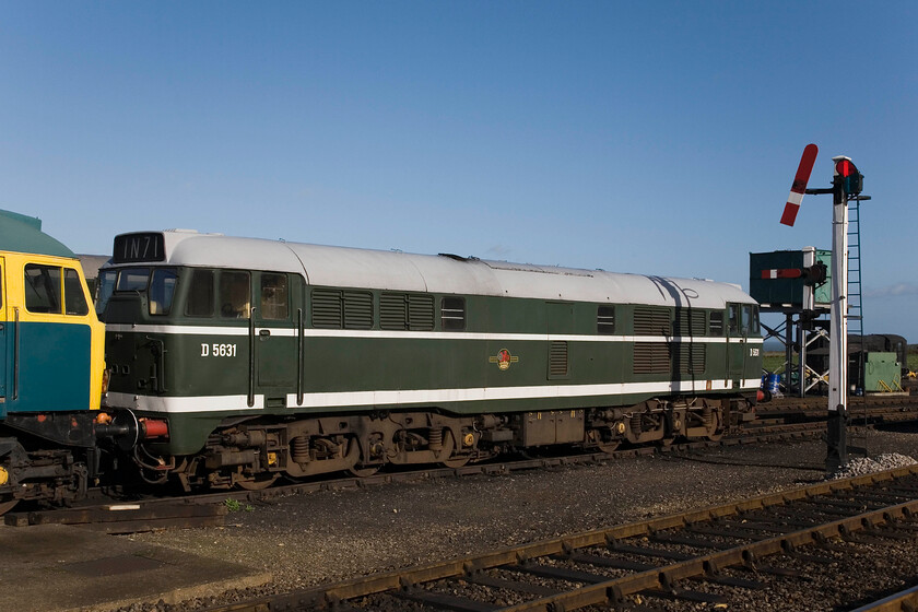 47367 & D5631, stabled, Weybourne Yard 
 Standing in Weybourne Yard on a superb autumn morning 47367 and D5631 (formally 31207) sit stabled awaiting their next turn of duty. Notice the superb GE somersault signal pulled off for the next Holt to Sheringham DMU service. 
 Keywords: NNR North Norfolk Railway 47367 D5631 Weybourne Yard