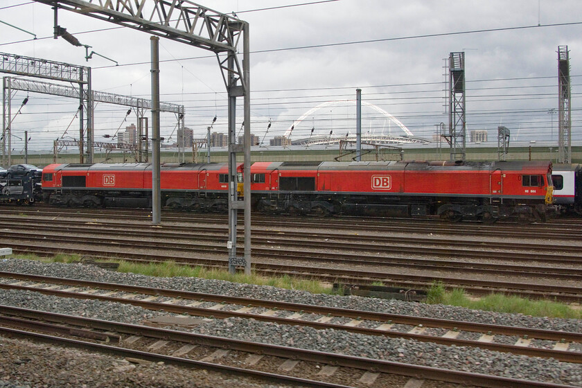 66044 & 66019, 02.57 Toton North Yard-Dollands Moor (6X11, 2L), Wembely Yard 
 Not a train that I have many photographs of due, in part, to its antisocial hour when passing through my home county of Northamptonshire. Having arrived at Wembley, the 6X11 02.57 Toton North yard to Dollands Moor has a layover before moving on. 66044 and 66019 lead the train that is composed of new Toyota cars all going for export to Europe built at the car maker's Burnaston factory to the south west of Derby. 
 Keywords: 66044 66019 02.57 Toton North Yard-Dollands Moor 6X11 Wembley Yard.