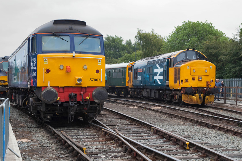 88002, 57007, 975025 & 37424 (37558), on-display, DRS Open Day, Gresty Bridge 
 Quite a collection on-display at the DRS Open day at Gresty Bridge. Just tucking into the far left is 88002 'Prometheus' being blocked in by 57007. Close observation reveals that the 57 has a nameplate attached covered with black plastic. Later in the afternoon, it was named 'John Scott 12.5.45-22.5.12' in memory of a former Kingmoor fitter and career railway engineer who worked for DRS. To the right of this image is observation carriage 975025 'Caroline' with 37424/37558 'Avro Vulcan XH558'. 
 Keywords: 88002 57007 975025 37424 37558 DRS Open Day, Gresty Bridge