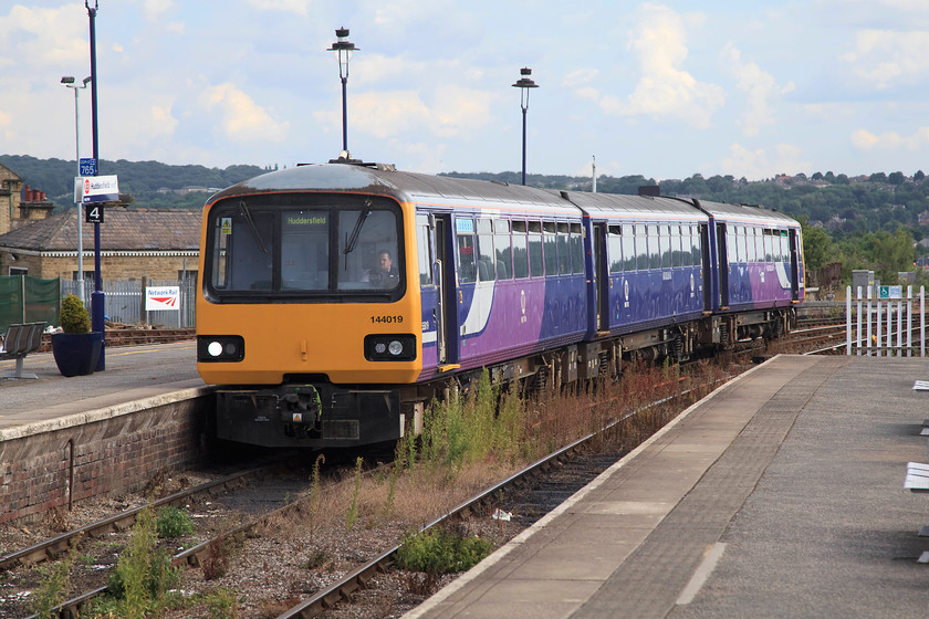 144019, NT 09.44 Wakefield Westgate-Huddersfield (2O70, 1L), Huddersfield station 
 It looks as though the weed-killing train has not traversed the two bay platform lines at Huddersfield for sometime. This is similar to large areas of the network that suffer from a chronic lack of day-to-day maintenance. 144019 arrives with the 2O70 09.44 train from Wakefield Westgate. 
 Keywords: 144019 2O70 Huddersfield station