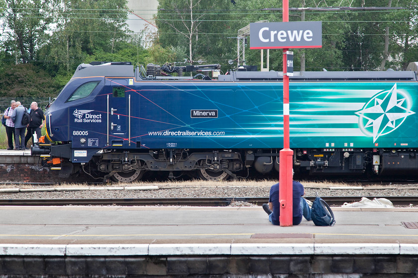 88005, 15.35 Crewe-London Euston, via Chester (1Z19), Crewe station 
 88016 'Minerva' sits at the rear of the returning 15.35 Crewe to Euston charter at Crewe station. This charter carried the faithful to and from the Crewe for the DRS Gresty Bridge Open Day that has become a major event on the railway enthusiasts calendar. This charter returned via a circuitous route through Chester to Shrewsbury and then to Birmingham and London. 68016 'Fearless' was at the front of the ex. BR Mk.II stock used. 
 Keywords: 68005 1Z19 Crewe station