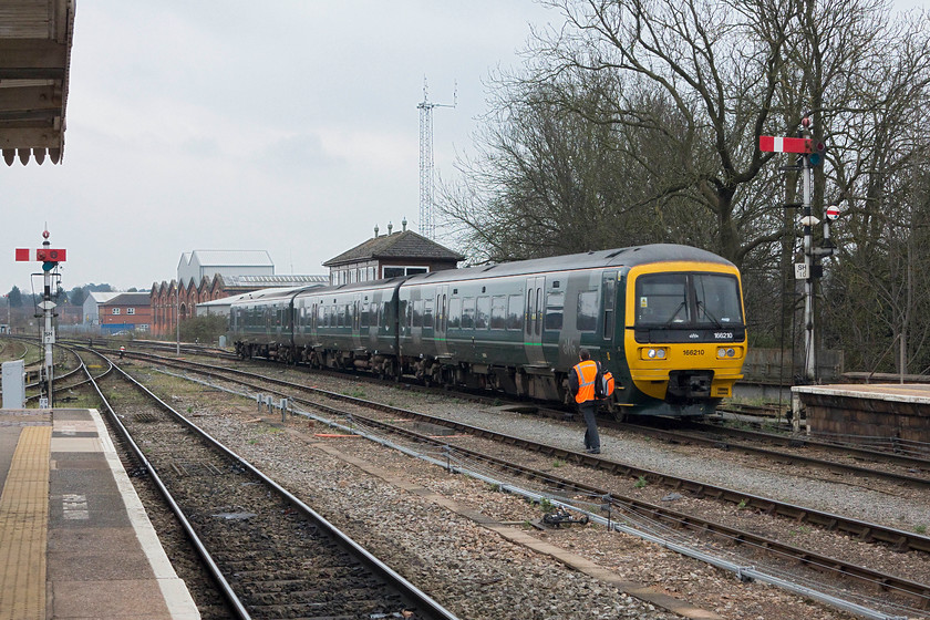 166210, GW 11.21 London Paddington-Great Malvern (1W29), Worcester Shrub Hill station 
 I am not at all sure that these 'Turbos' are entirely suited to do a journey that this one is close to completing? 166210 arrives into Worcester Shrub Hill station working the 11.21 Paddington to Great Malvern 1W29 service. I am also not at all sure that this GW livery is the best? Not only are they difficult to photograph well but they do look a little drab in most light, a flash or lining could improve their look perhaps? 
 Keywords: 166210 1W29 Worcester Shrub Hill station